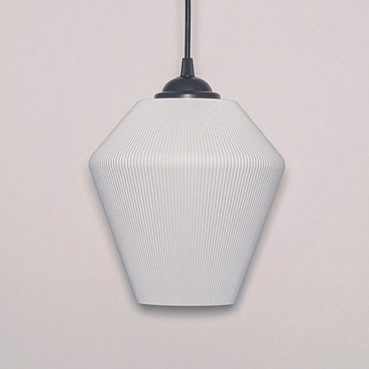 Dryft Homes Inversis Pendant Light showcases a modern geometric white design suspended by a black cord. Crafted sustainably with a 3D printed lampshade, its subtle ribbed texture adds a stylish, minimalist touch to any plain white wall.